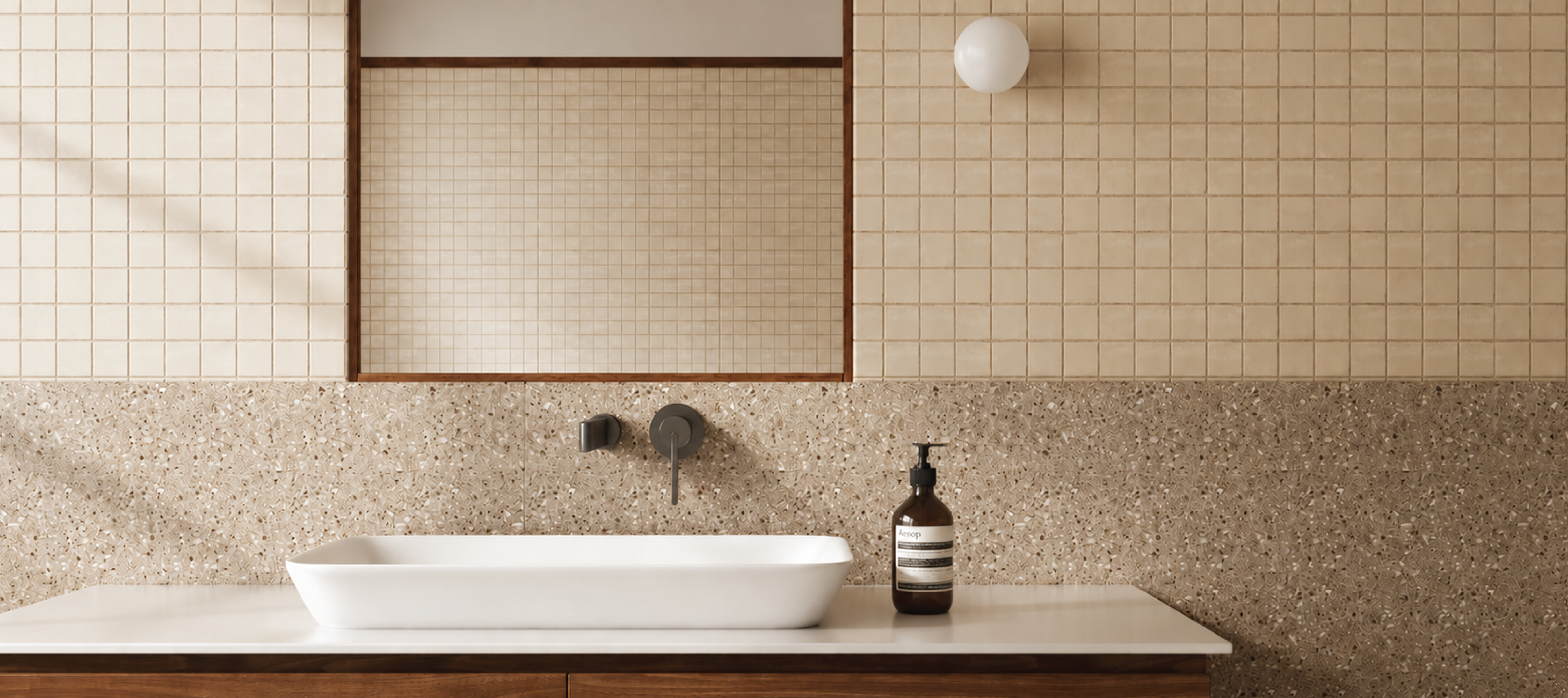 Bathroom with a white sink, tiled walls, and a bottle on the counter.