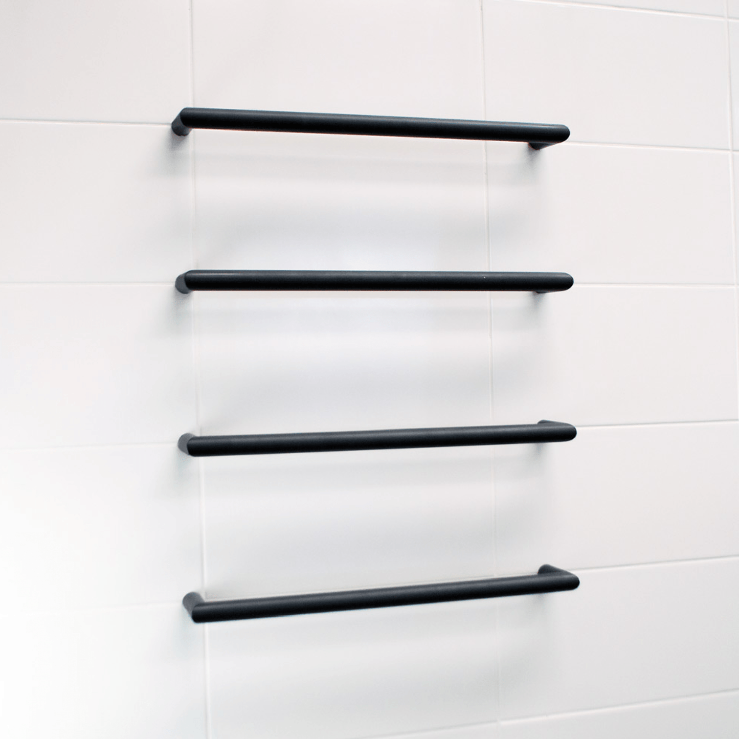 RADIANT - BSBRTR - 650 Heated Low Voltage Single Round Bar 650mm Matt Black - Heated Towel Rails - from our - Radiant - supplier–available at Bathroom City Perth