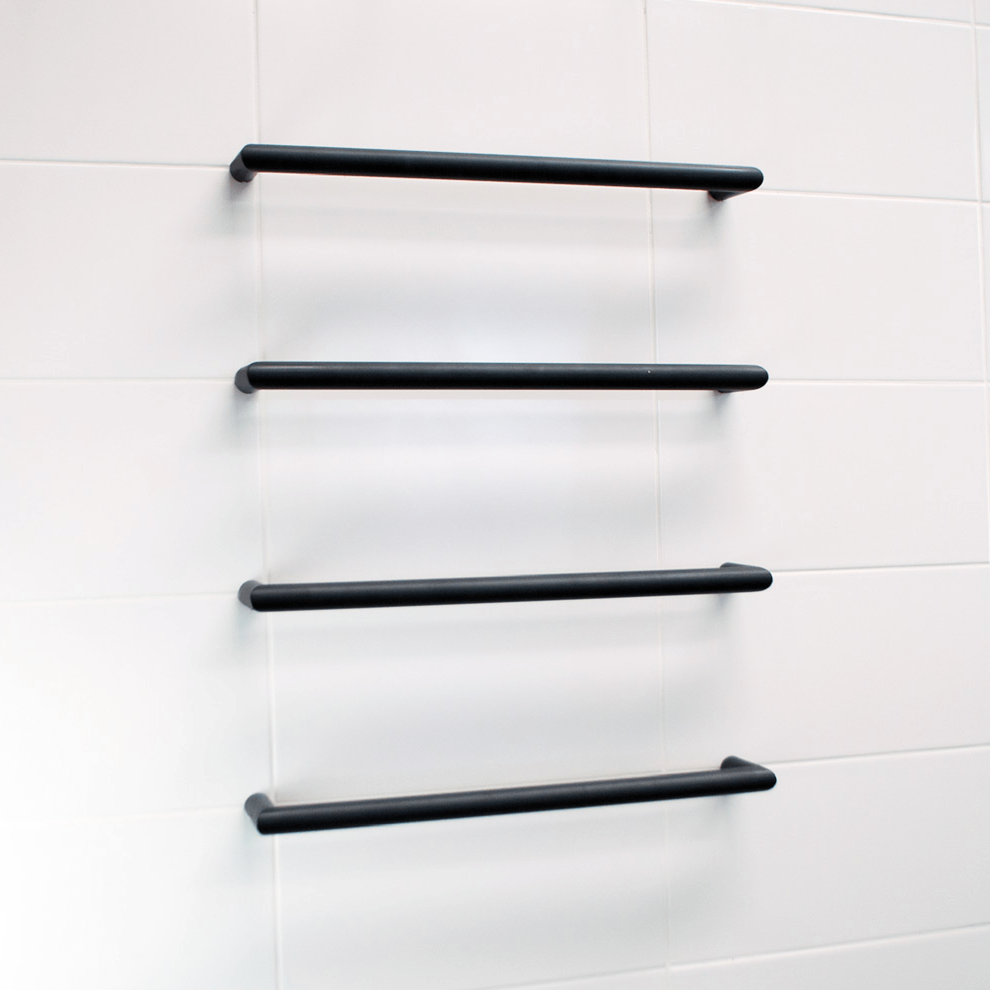 RADIANT - BSBRTR - 650 Heated Low Voltage Single Round Bar 650mm Matt Black - Heated Towel Rails - from our - Radiant - supplier–available at Bathroom City Perth
